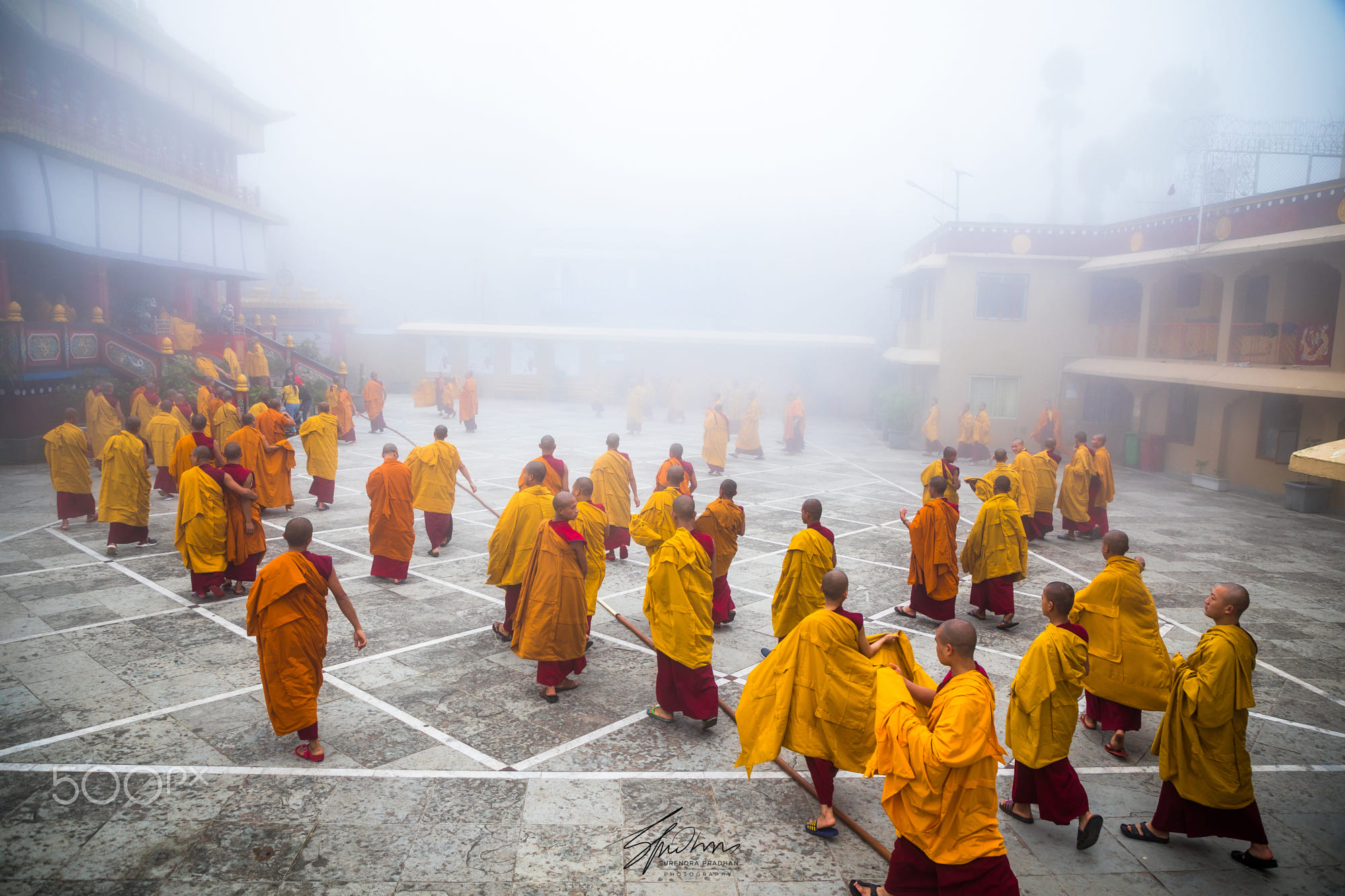 The Buddhist monks back to the prayer hall at the Bokar Monastery