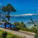 Embark on a nostalgic voyage through the quaint and charming town of Darjeeling, aboard the Joy Ride